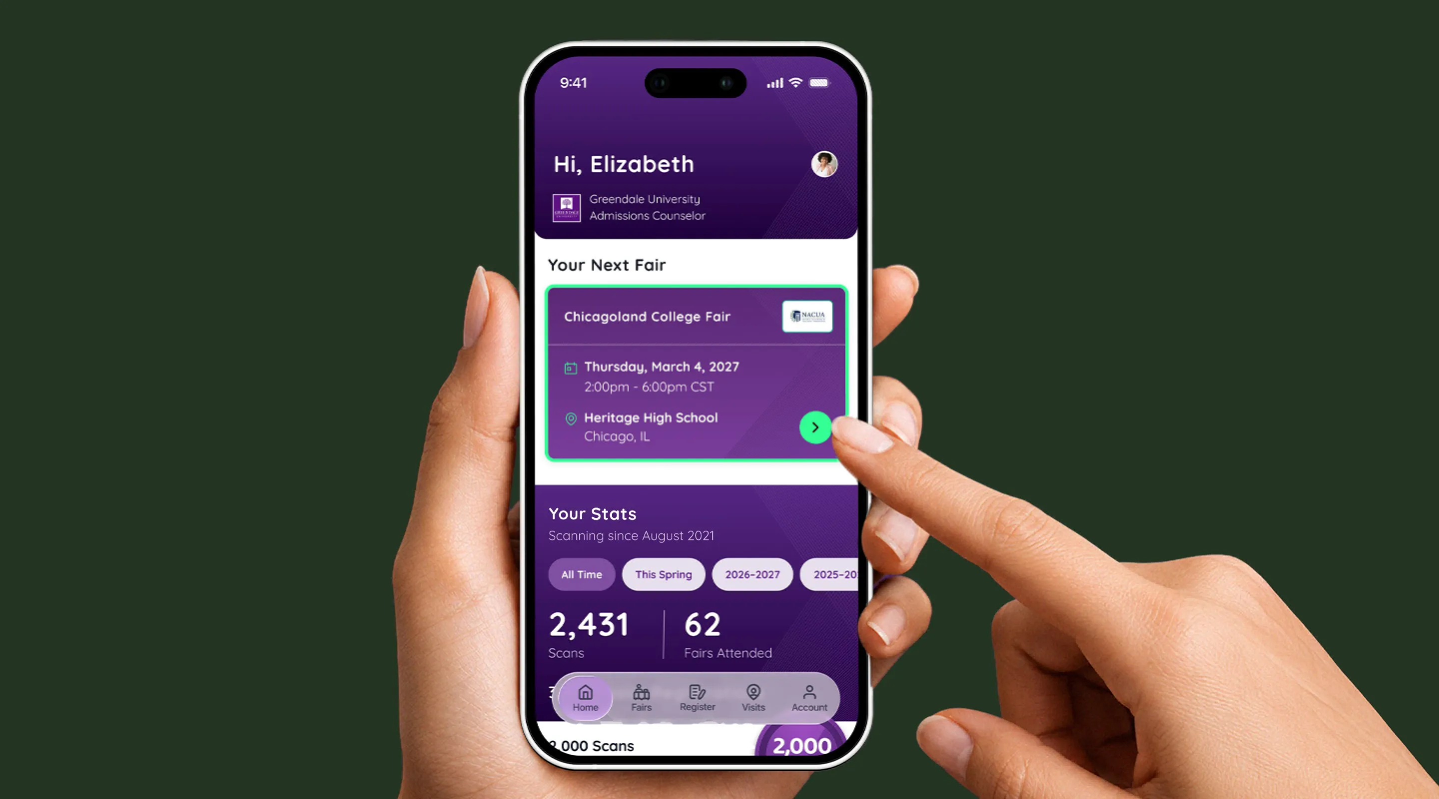 Hand holding a phone running the app's home screen